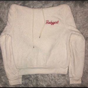 White furry hoodie with red babygirl letters.